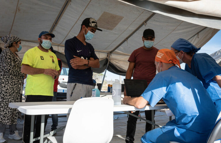 People attend a Covid-19 vaccination campaign