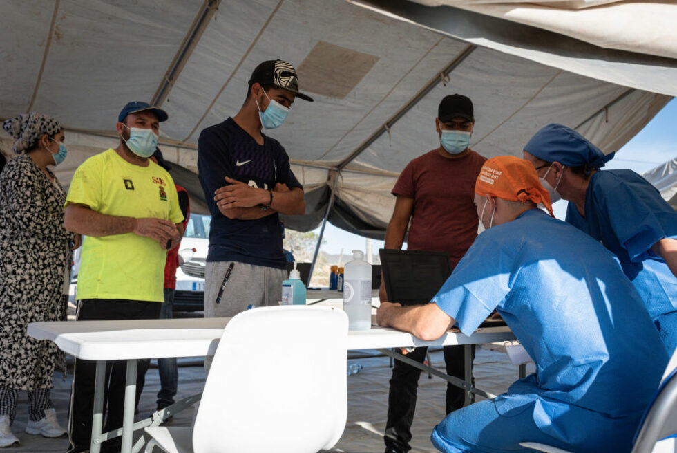 People attend a Covid-19 vaccination campaign